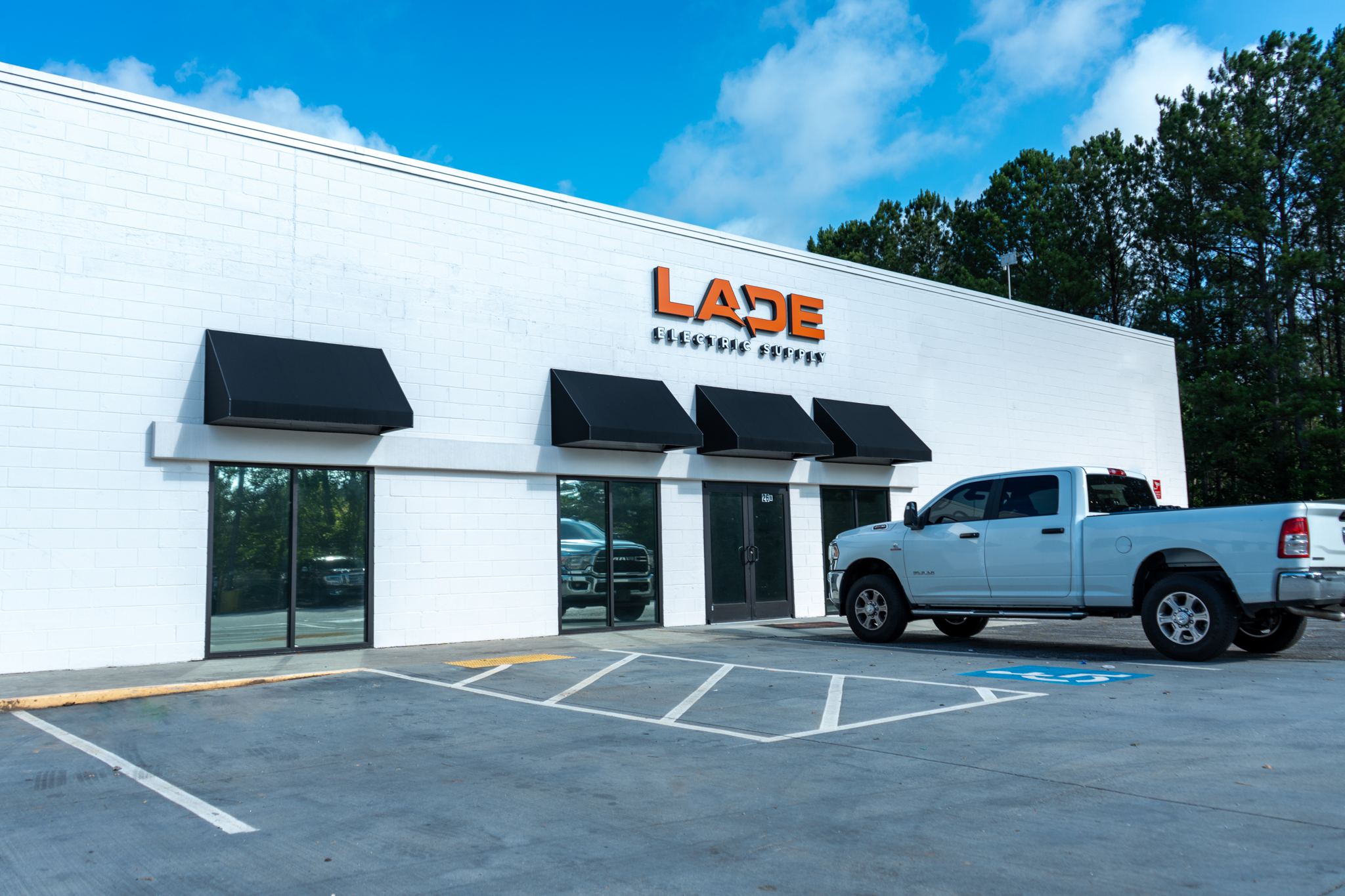 Exterior photo of Lade Supply Branch in Hiram, showing the store entrance and the company branding.